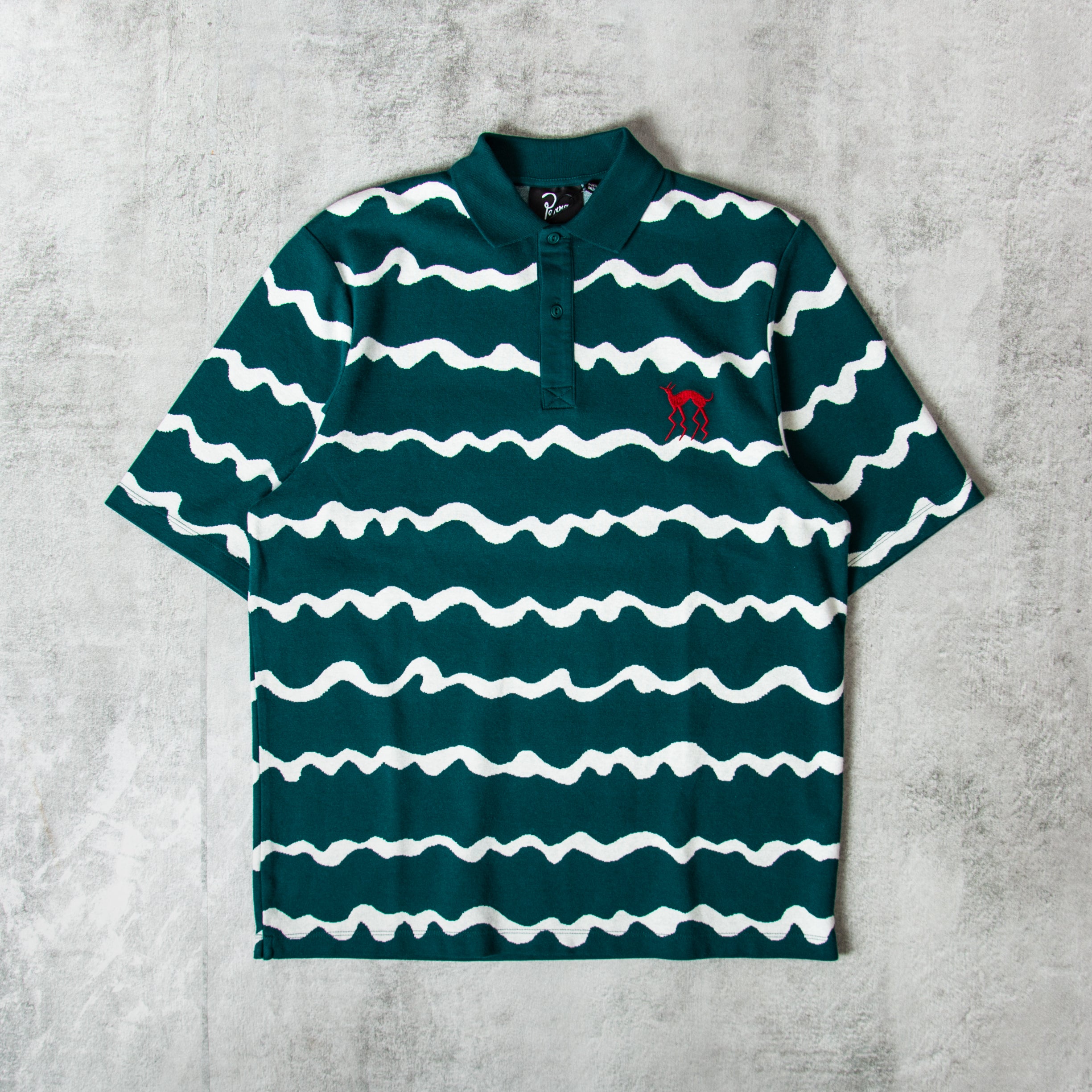 Buy the By Parra Broken Waves Polo Shirt Pine Green @Union