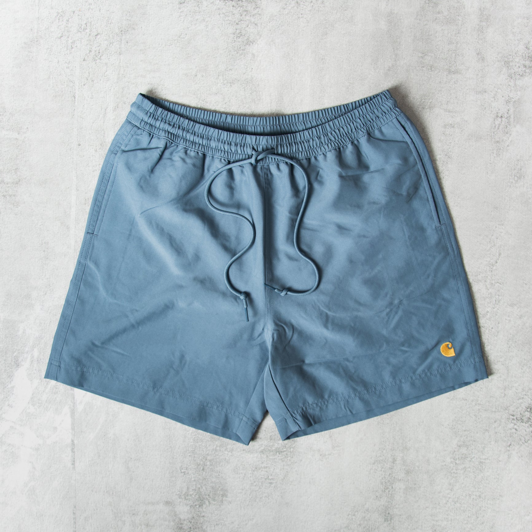 【未使用】carhartt WIP Chase Swim Trunks Buy the Carhartt WIP Chase Swim Trunks - Blue / Gold @Union
