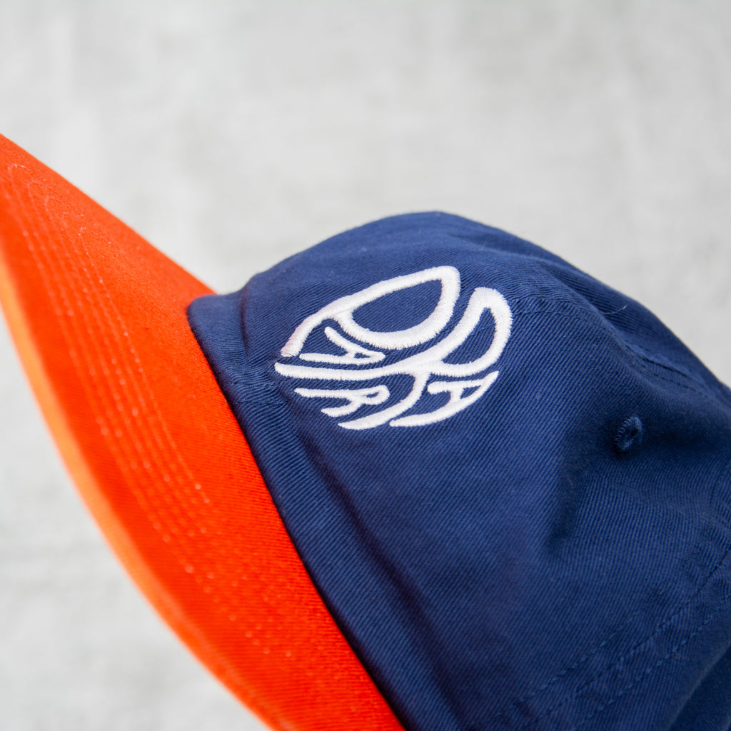 By Parra Circle Tweak Logo 6 Panel Cap - Navy / Orange 2